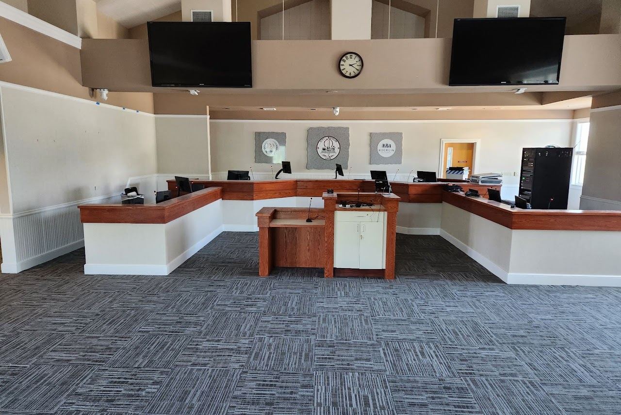 Renovated City of Rocklin council chamber with millwork dais, member stations and audio-visual displays